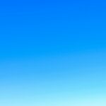 A serene view of a vibrant clear blue sky with a subtle gradient, perfect for backgrounds.